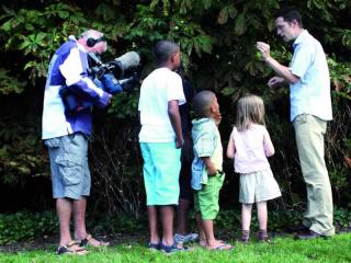 Photo of scientist and children